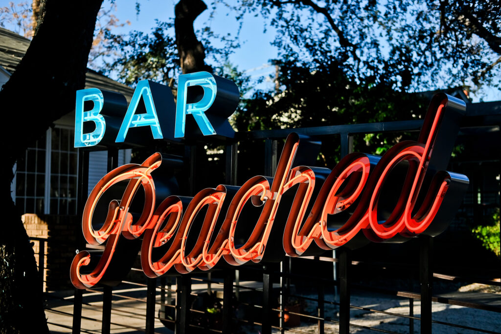 2018_inkedfingers_barpeached_08 a painting at a table in an empty home, in the style of pop art-inspired portraits, southern countryside, color photography pioneer, use of vintage imagery, jim lively, outdoor art, martin puryear